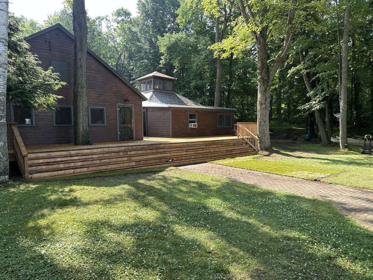 The property and open lawn among the trees