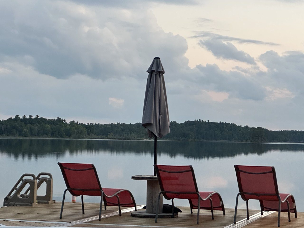 Muskoka chairs at the water's edge